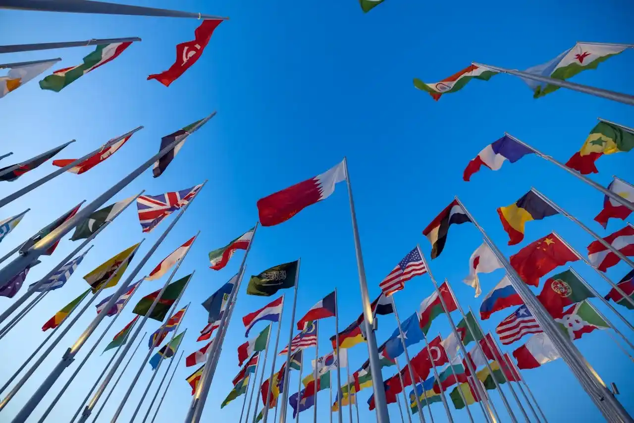 International flags representing global cross-border legal expertise and international business relationships